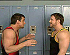Two older jocks are fighting in the locker room